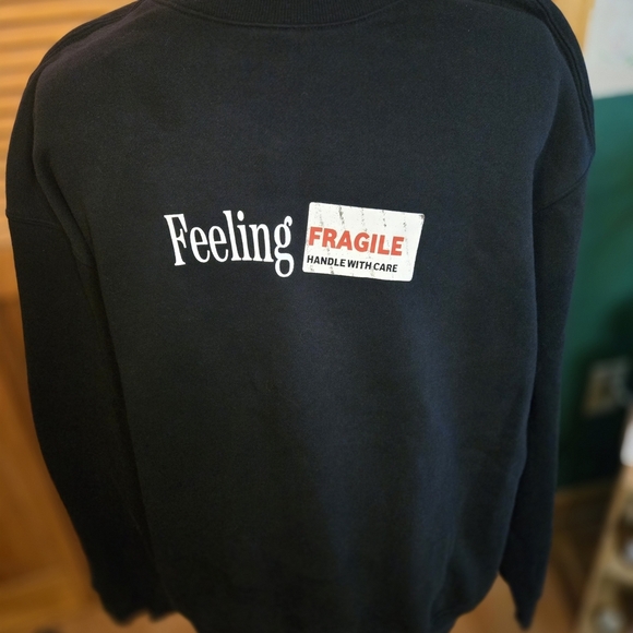 H&M Tops - H&M Black 'Feeling Fragile' Crewneck Sweater